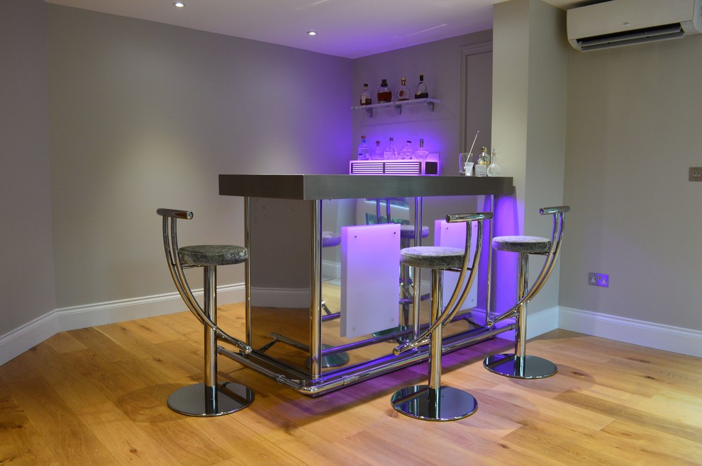 Design ideas for a modern home bar in Surrey.