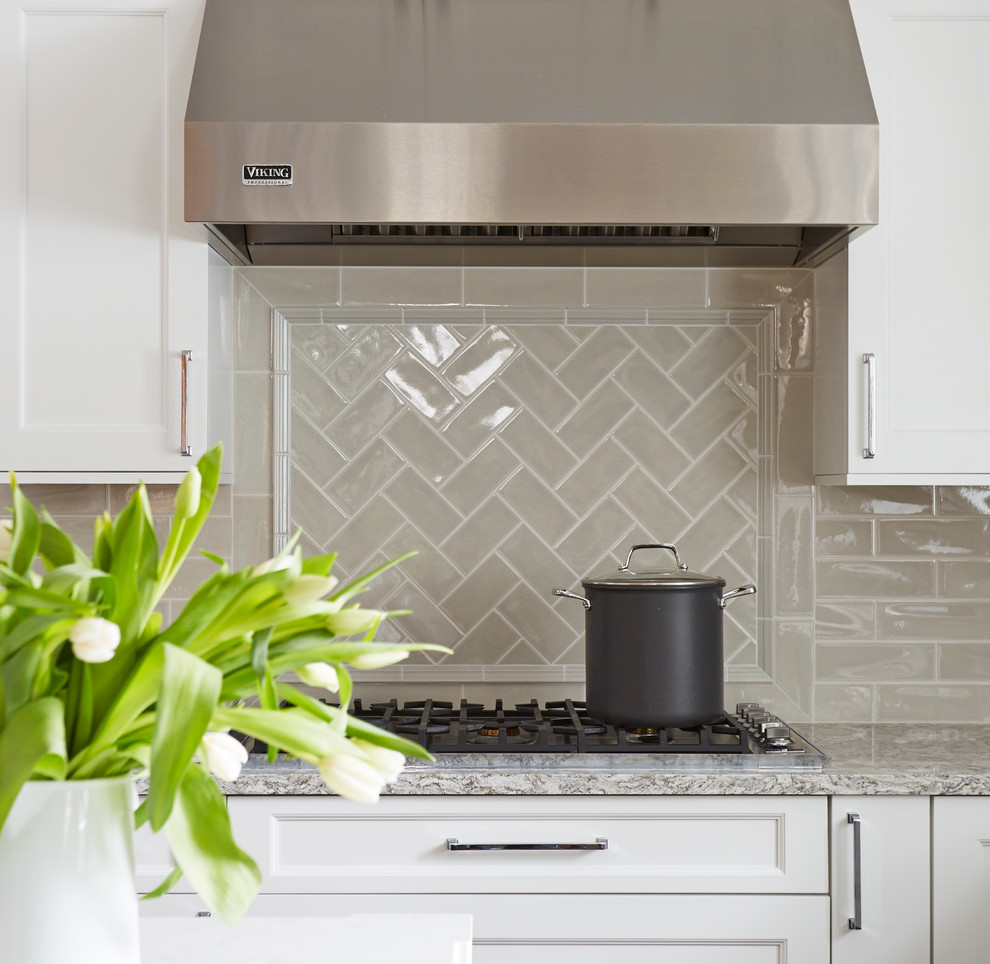 Open concept kitchen - large transitional u-shaped medium tone wood floor open concept kitchen idea in Chicago with a double-bowl sink, flat-panel cabinets, white cabinets, quartz countertops, beige backsplash, subway tile backsplash, stainless steel appliances and an island