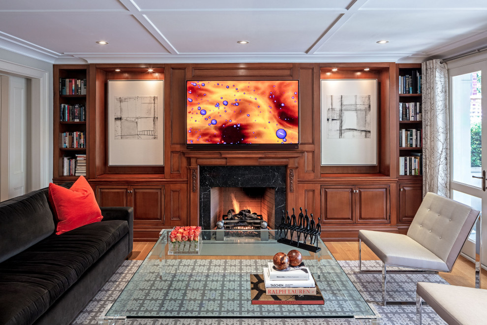 Large traditional enclosed games room in Toronto with white walls, medium hardwood flooring, a standard fireplace, a stone fireplace surround, a wall mounted tv, brown floors, a coffered ceiling and panelled walls.