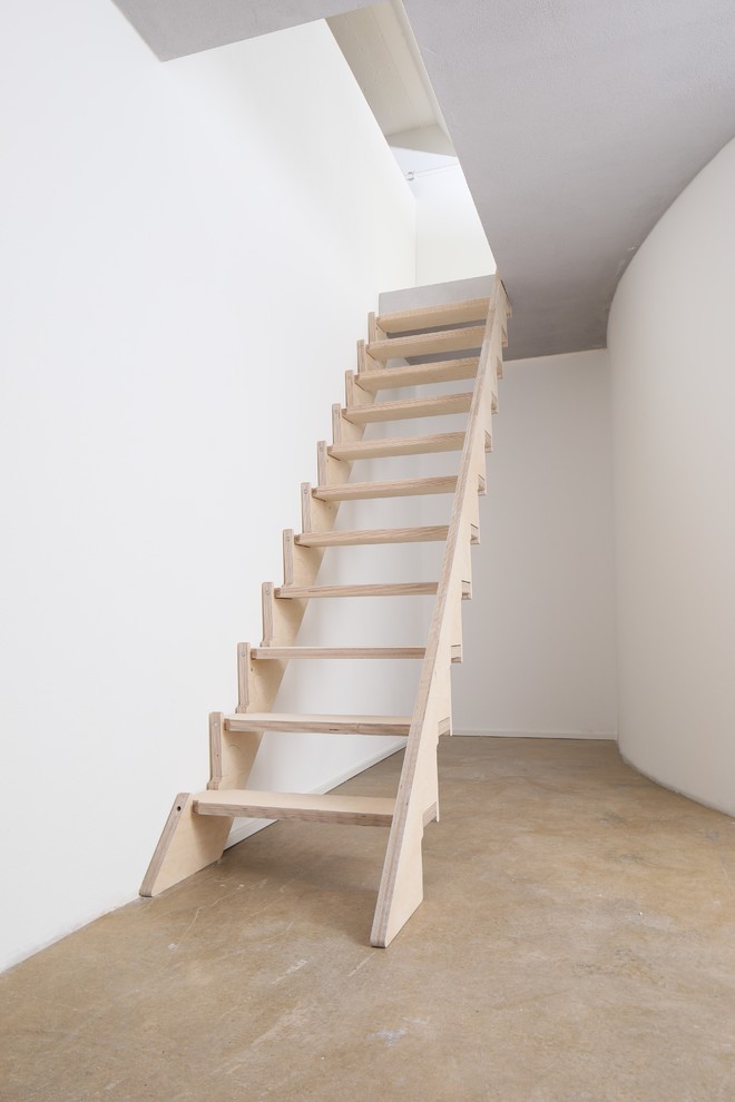 Photo of a mid-sized modern wood straight staircase.