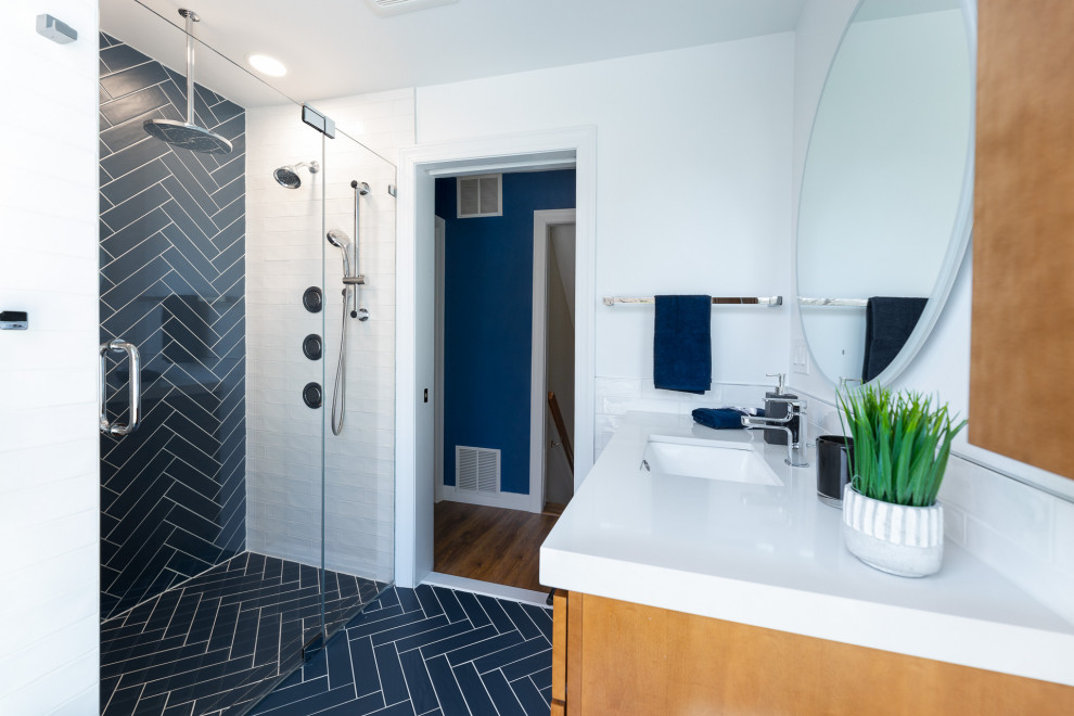 This is an example of a mid-sized modern bathroom in New York with light wood cabinets, a curbless shower, white tile, cement tiles, an undermount sink, quartzite benchtops, a hinged shower door, white benchtops, a single vanity and a built-in vanity.