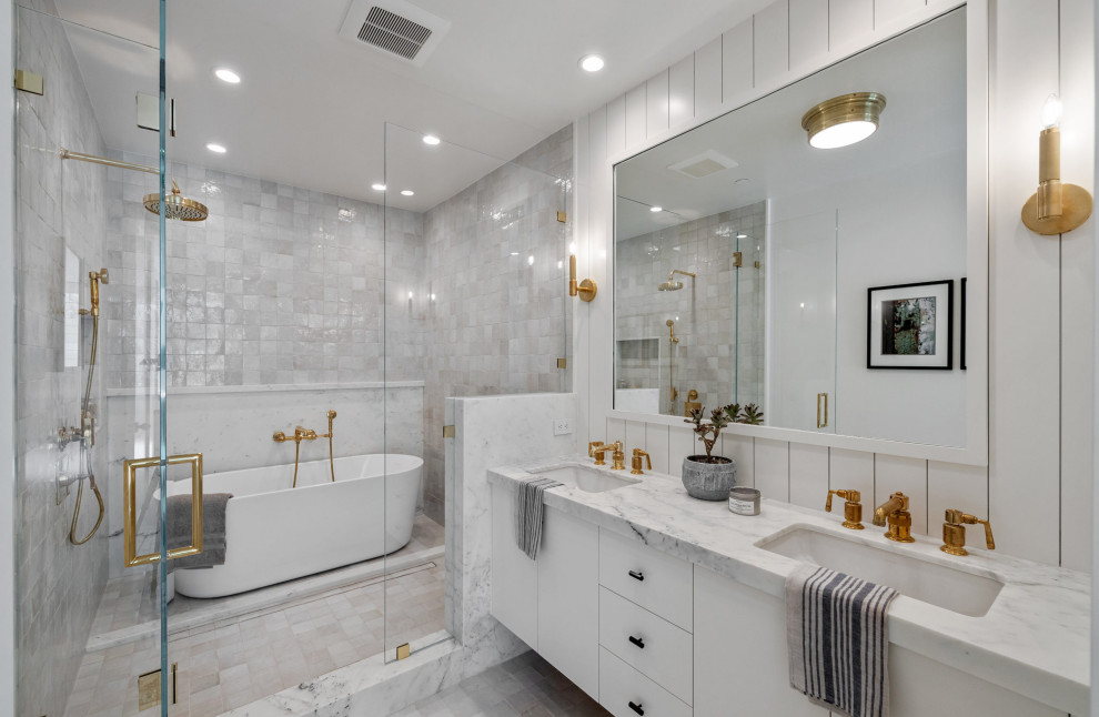 Design ideas for a contemporary master wet room bathroom in San Francisco with flat-panel cabinets, white cabinets, a freestanding tub, white walls, an undermount sink, marble benchtops, a hinged shower door, grey benchtops, a double vanity and a floating vanity.
