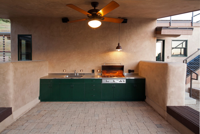 Patio - modern single-wall patio idea in San Luis Obispo with stainless steel appliances, metallic backsplash, stainless steel countertops, green cabinets, flat-panel cabinets and a drop-in sink