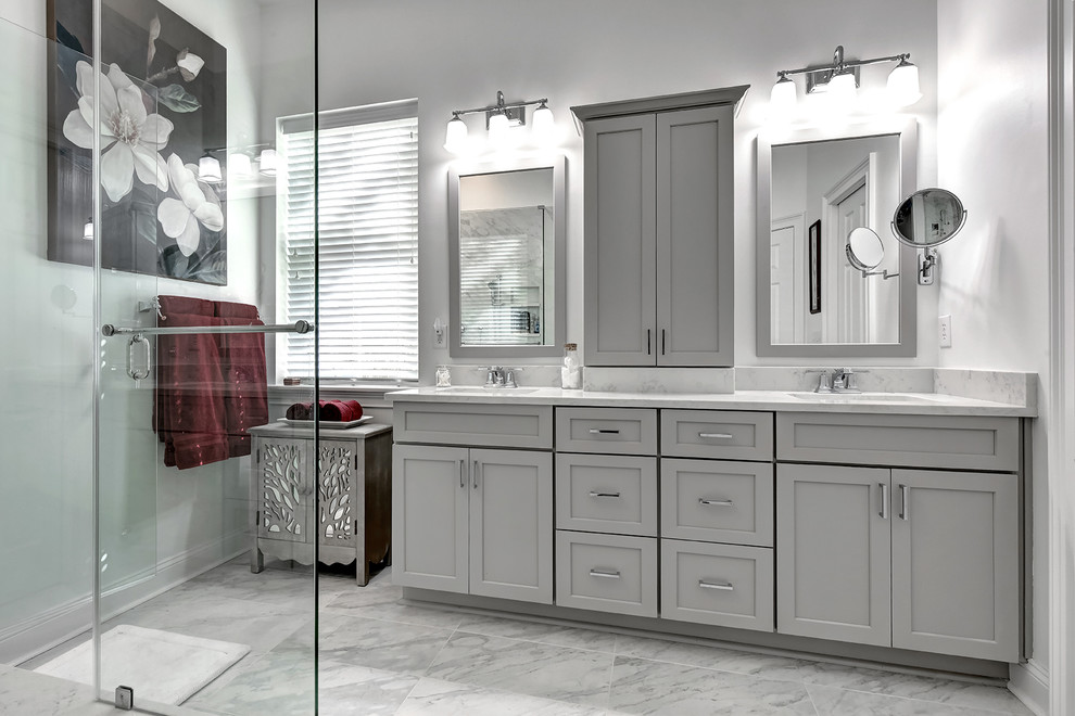 Inspiration for a mid-sized contemporary master bathroom in Charleston with shaker cabinets, grey cabinets, a corner shower, a two-piece toilet, gray tile, porcelain tile, grey walls, porcelain floors, an undermount sink and engineered quartz benchtops.