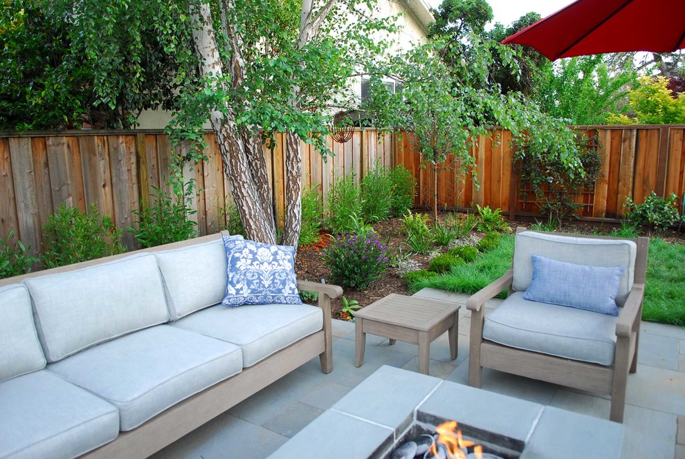 Mid-sized traditional backyard patio in San Francisco with natural stone pavers, a fire feature and no cover.