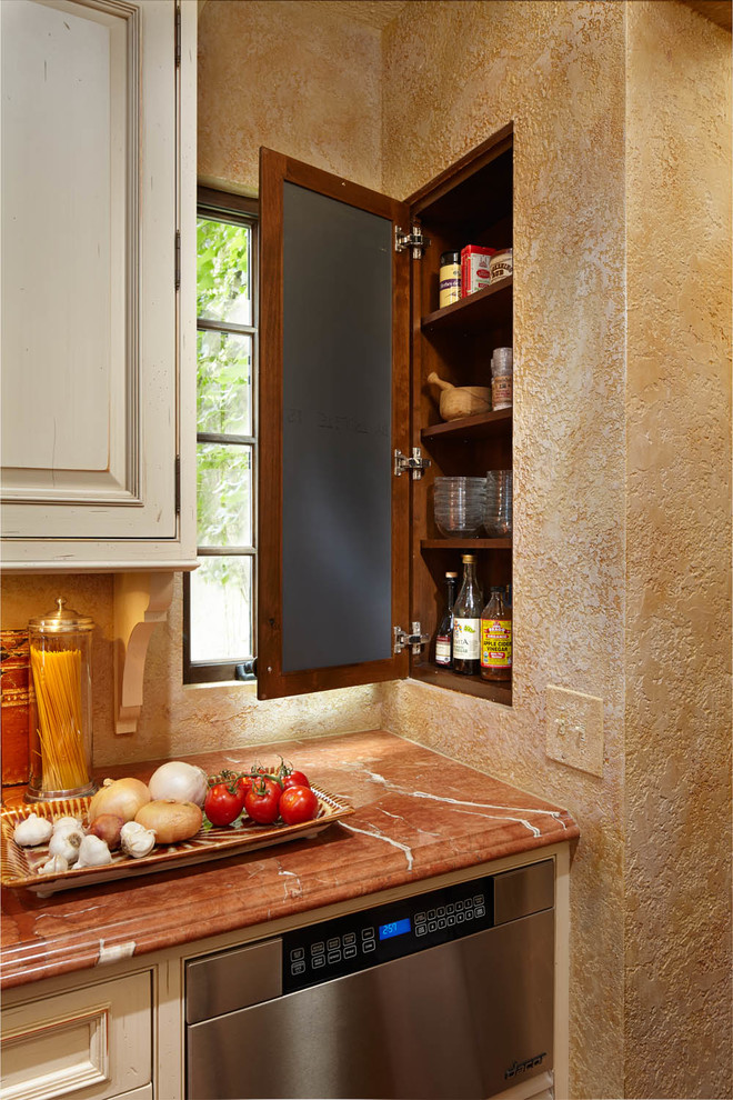This is an example of a mediterranean kitchen in Minneapolis with beaded inset cabinets, marble benchtops, mosaic tile splashback and medium hardwood floors.