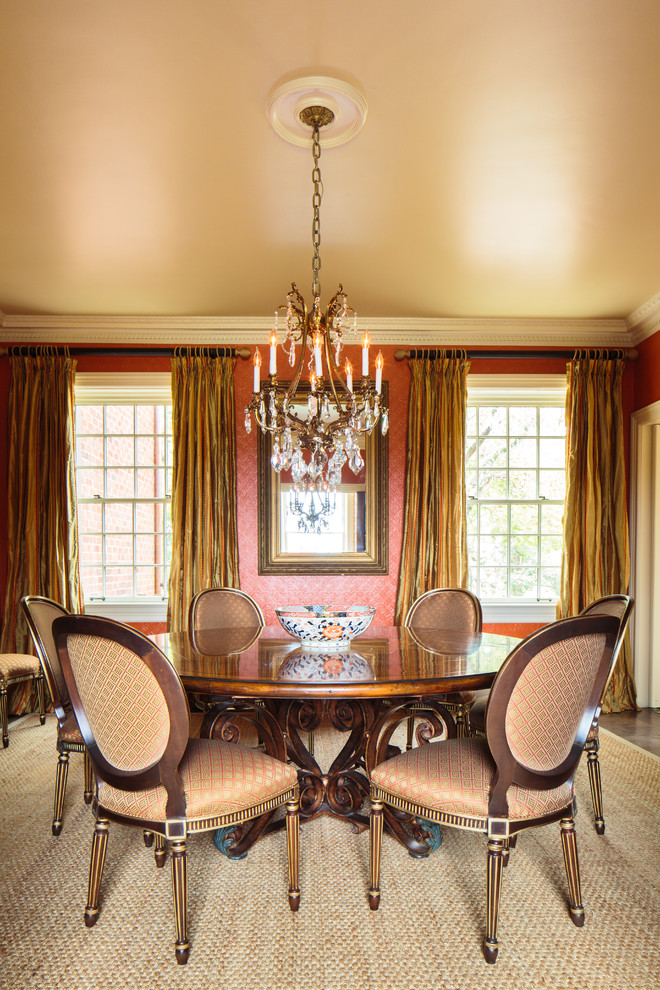 Inspiration for a traditional dining room in Other with red walls.