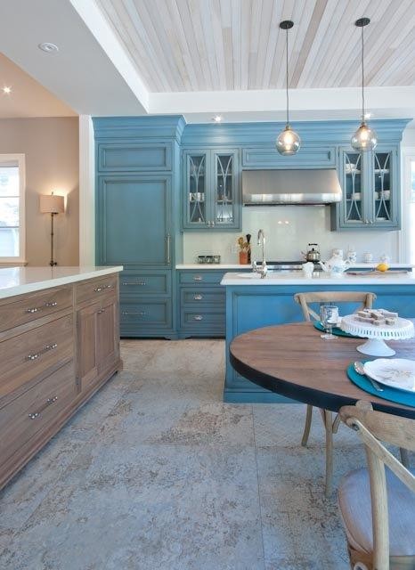 Eat-in kitchen - large rustic u-shaped ceramic tile and beige floor eat-in kitchen idea in Toronto with a farmhouse sink, beaded inset cabinets, blue cabinets, quartzite countertops, white backsplash, stone slab backsplash, stainless steel appliances and an island