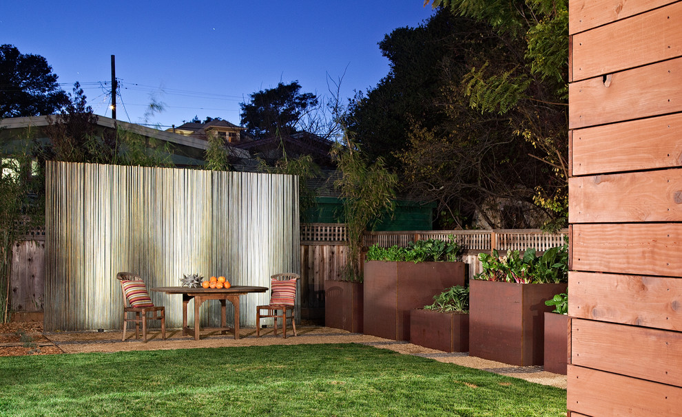 Design ideas for a mid-sized contemporary backyard partial sun formal garden for spring in San Francisco with a vegetable garden and gravel.