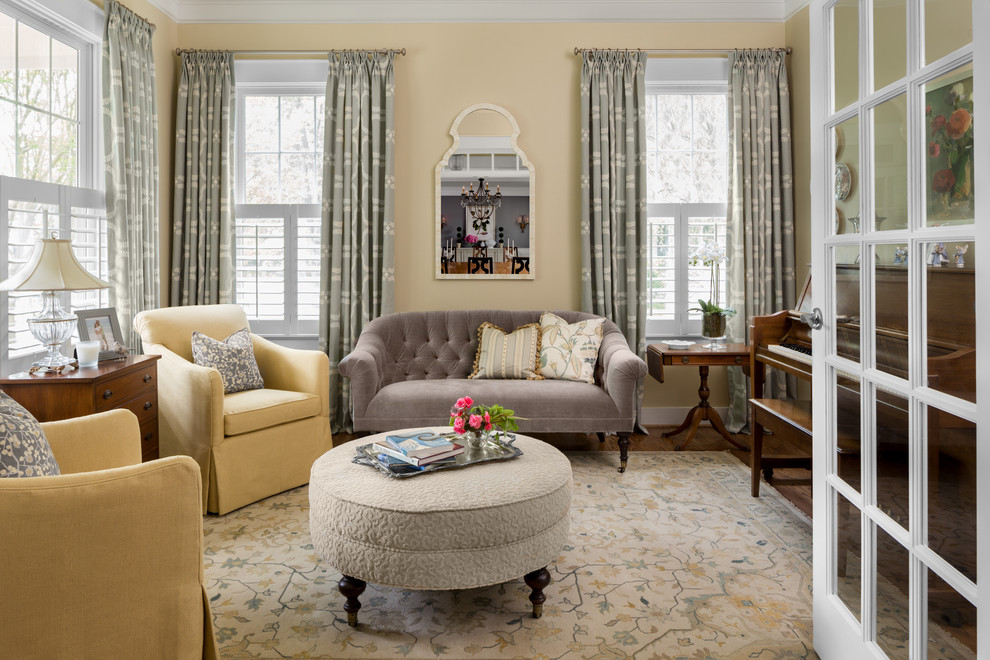 Inspiration for a mid-sized traditional formal enclosed living room in DC Metro with yellow walls, dark hardwood floors, no fireplace and no tv.
