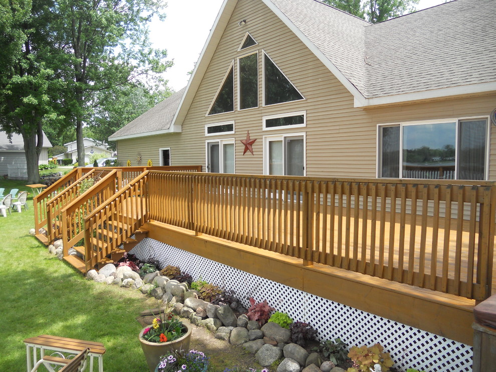 Photo of a large country backyard deck in Grand Rapids with no cover.