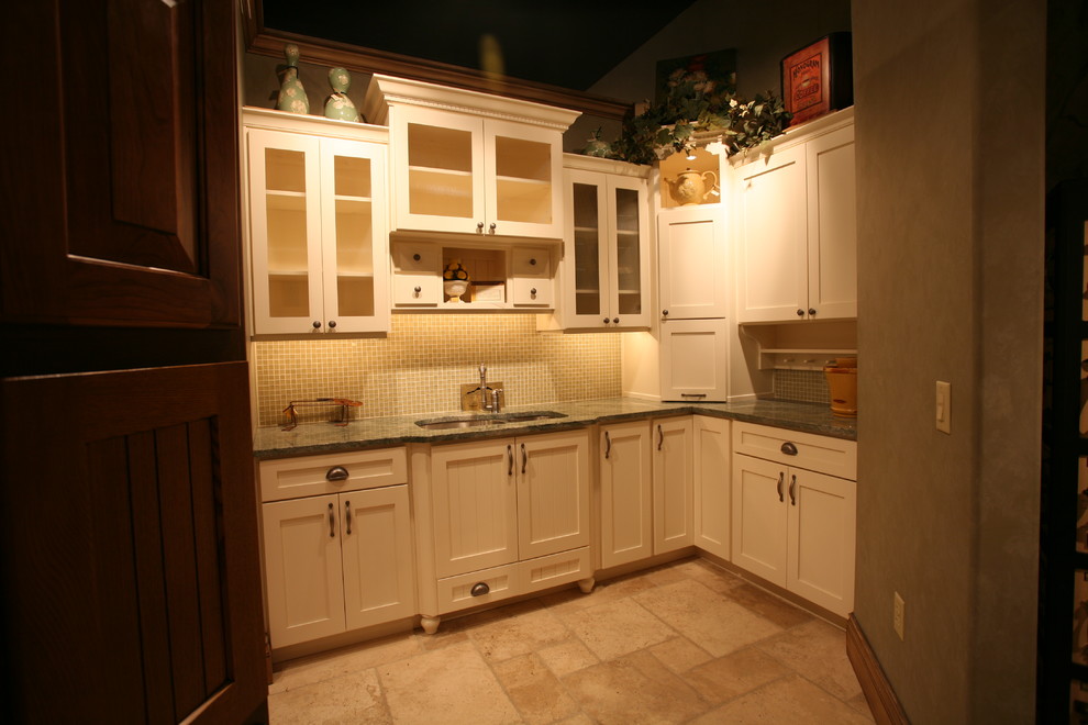 Enclosed kitchen - large transitional l-shaped porcelain tile and beige floor enclosed kitchen idea with an undermount sink, shaker cabinets, white cabinets, granite countertops, beige backsplash, glass sheet backsplash, stainless steel appliances and no island