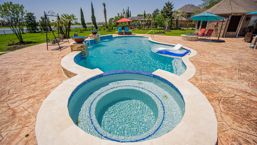 Photo of a large beach style backyard custom-shaped pool in Houston.