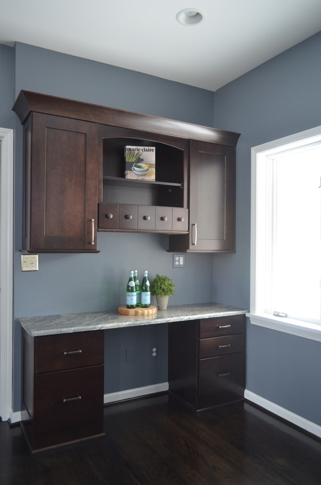 Inspiration for a transitional eat-in kitchen remodel in New York with shaker cabinets, dark wood cabinets and granite countertops