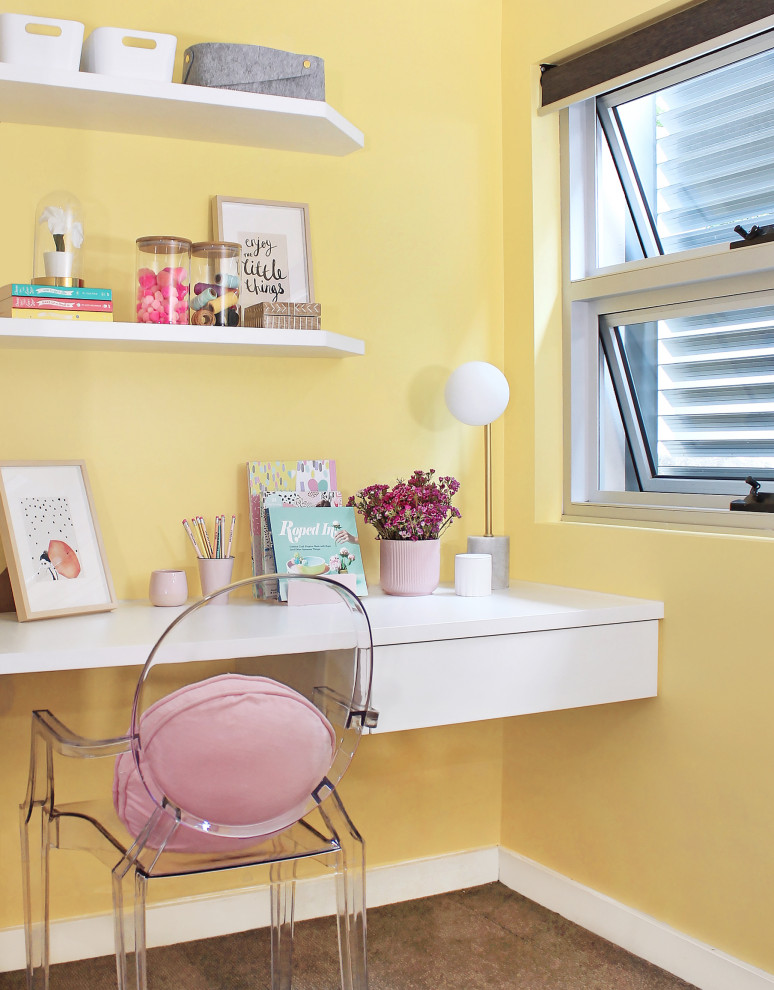 This is an example of a mid-sized contemporary kids' room in Sydney with yellow walls and brown floor.