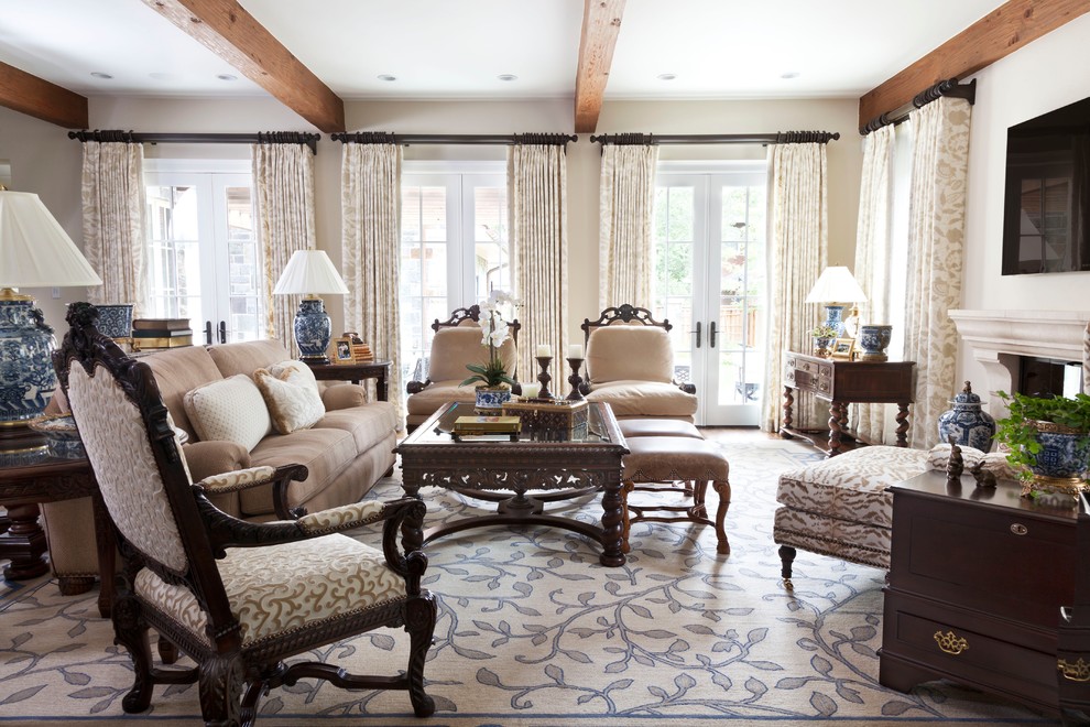 This is an example of a large traditional open concept family room in Denver with beige walls, dark hardwood floors, a standard fireplace, a stone fireplace surround and a wall-mounted tv.