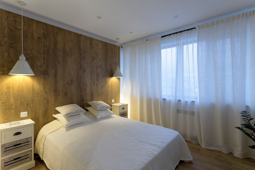 Inspiration for a medium sized guest bedroom in Moscow with white walls and medium hardwood flooring.
