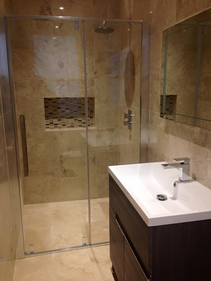 Inspiration for a medium sized contemporary ensuite bathroom in London with flat-panel cabinets, dark wood cabinets, a built-in shower, beige tiles, stone tiles and travertine flooring.