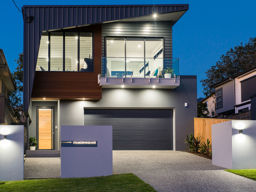 Design ideas for a contemporary two-storey grey house exterior in Brisbane with a flat roof and a metal roof.