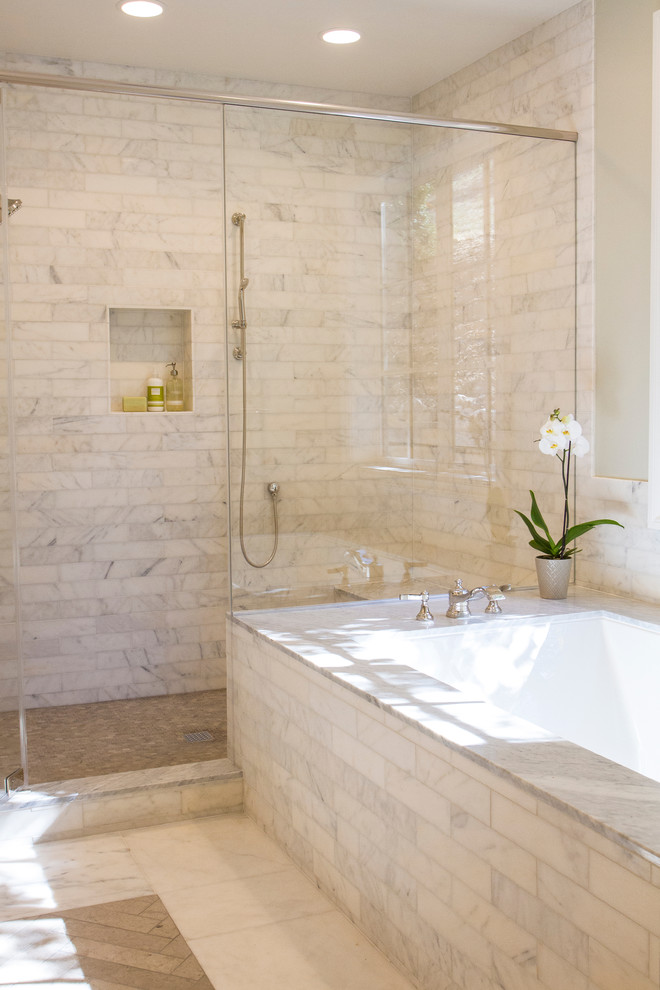 This is an example of a large traditional master bathroom in San Francisco with marble benchtops, an undermount tub, a double shower, white tile, stone tile, grey walls, marble floors, grey floor, a hinged shower door, recessed-panel cabinets, grey cabinets, a two-piece toilet and an undermount sink.