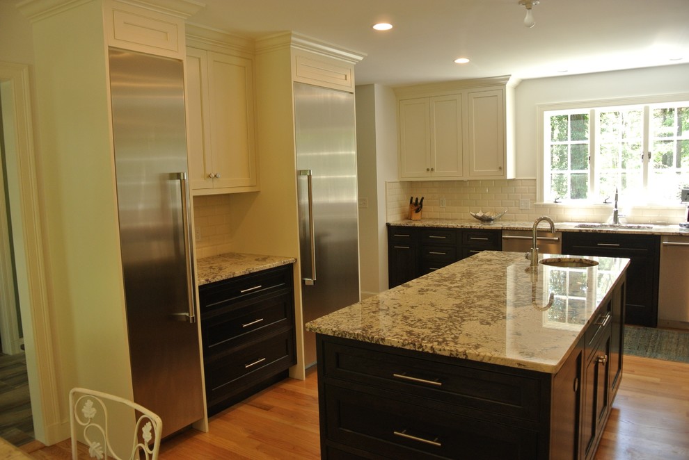 Transitional light wood floor eat-in kitchen photo in Boston with an undermount sink, shaker cabinets, granite countertops, white backsplash, subway tile backsplash, stainless steel appliances and an island