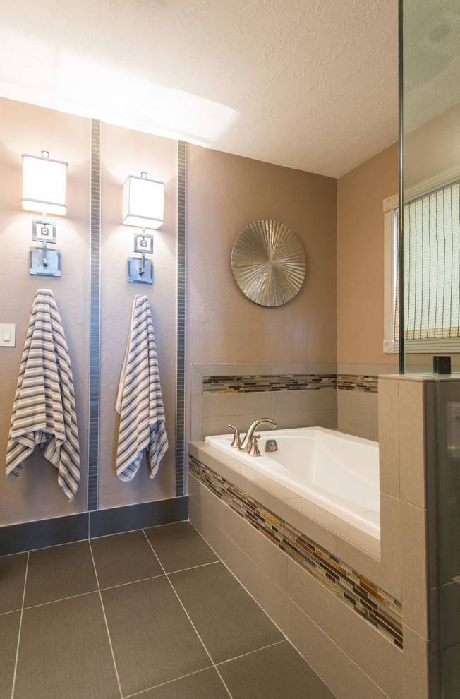 Inspiration for a transitional beige tile and matchstick tile drop-in bathtub remodel
