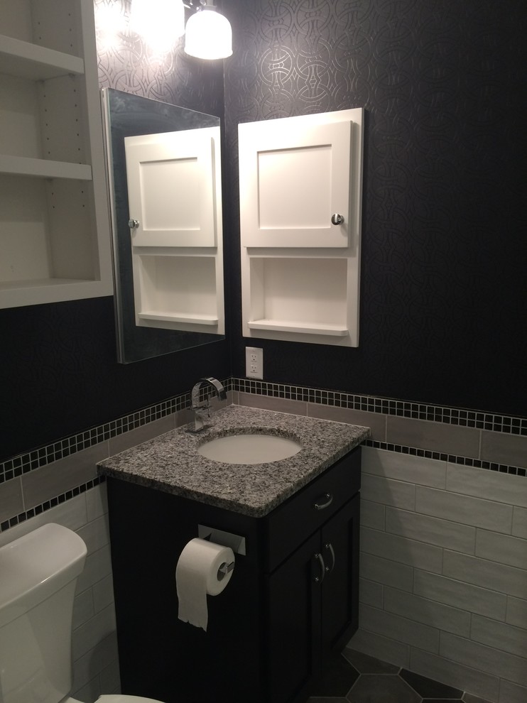 Inspiration for a small transitional master white tile and cement tile porcelain tile alcove shower remodel with shaker cabinets, dark wood cabinets, black walls, an undermount sink and granite countertops
