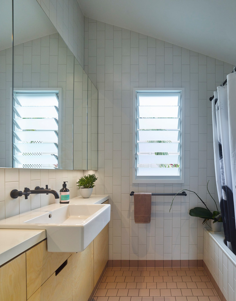 Inspiration for a small contemporary master bathroom in Brisbane with glass-front cabinets, an open shower, a one-piece toilet, white tile, ceramic tile, white walls, ceramic floors, a wall-mount sink, tile benchtops, brown floor and an open shower.