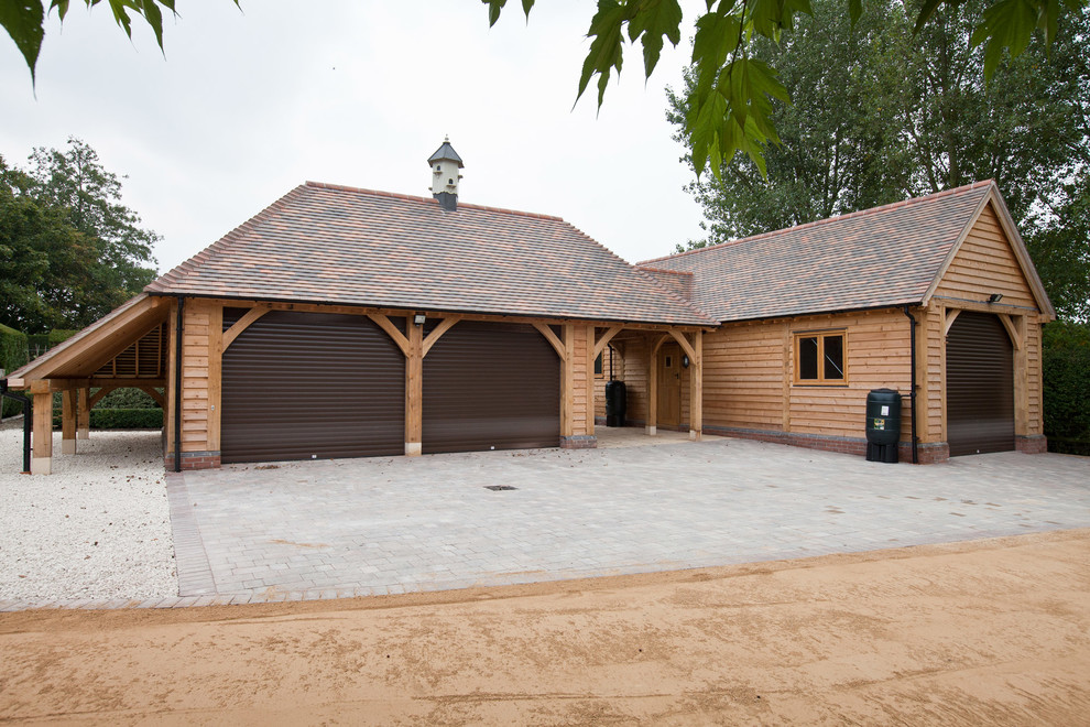 Inspiration for a country three-car garage in West Midlands.