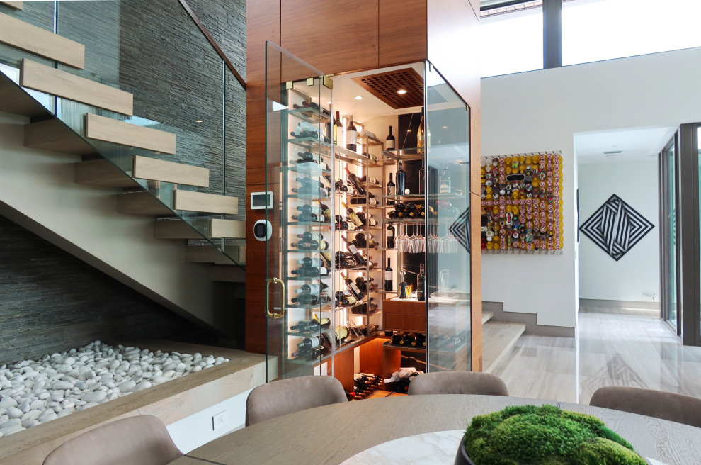 Inspiration for a transitional wine cellar in Miami.
