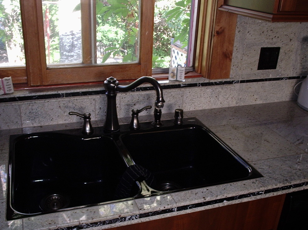 Example of a transitional kitchen design in Denver with a double-bowl sink and tile countertops