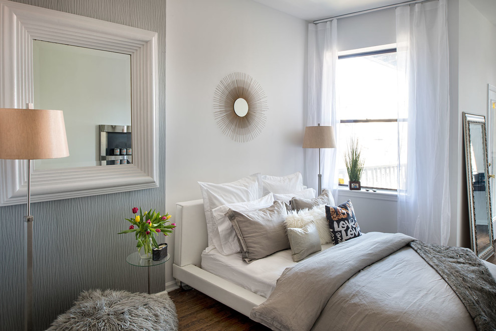 Bedroom - contemporary dark wood floor bedroom idea in New York with white walls
