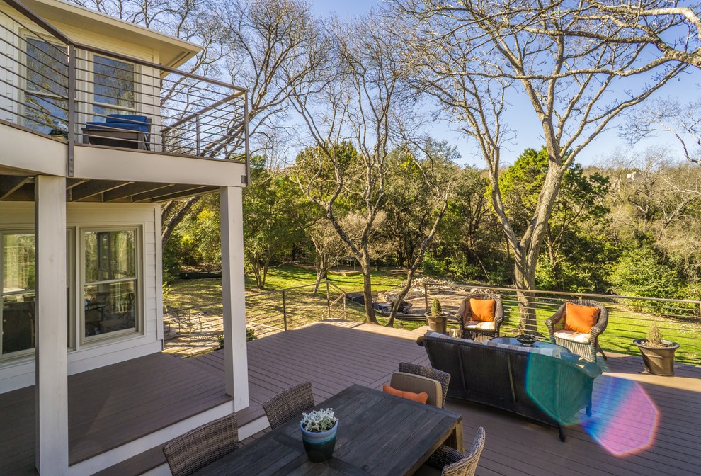 Large contemporary backyard deck in Austin with no cover.
