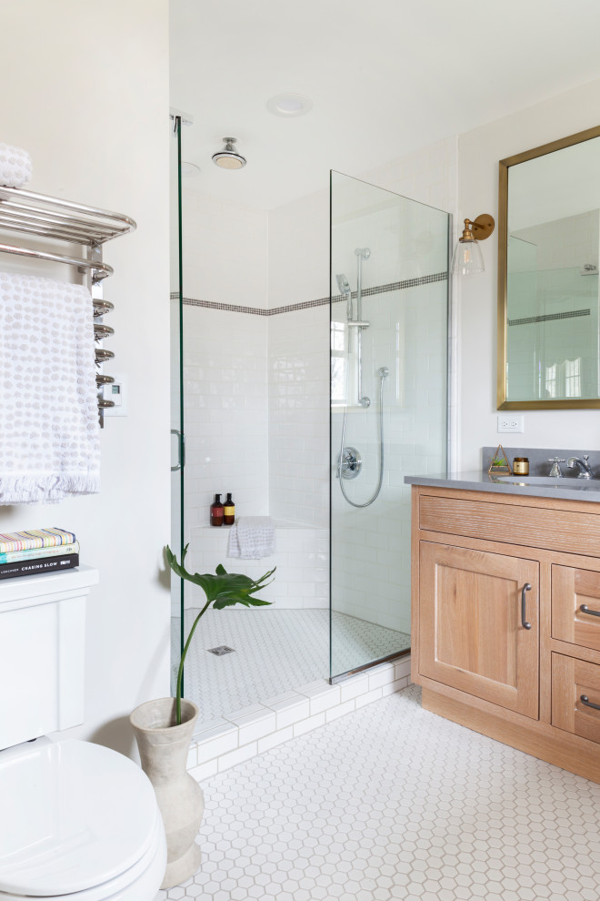 Mid-sized transitional master white tile ceramic tile, white floor and double-sink alcove shower photo in Chicago with shaker cabinets, light wood cabinets, a two-piece toilet, gray walls, a drop-in sink, quartz countertops, a hinged shower door, gray countertops and a freestanding vanity
