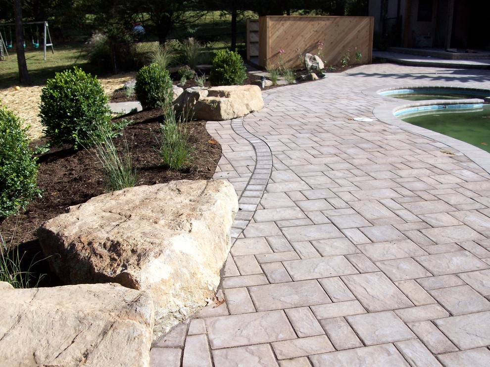 Inspiration for a large rustic full sun backyard concrete paver landscaping in Baltimore.