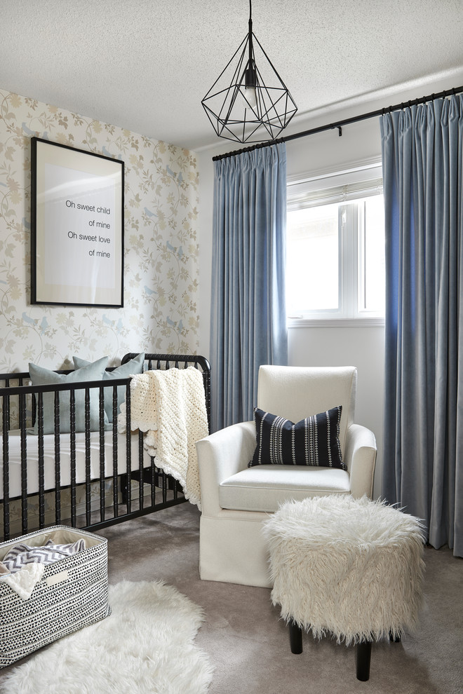 Photo of a small traditional nursery for boys in Toronto with carpet, multi-coloured walls and grey floor.