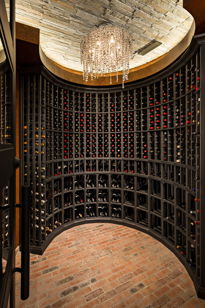 Design ideas for a transitional wine cellar in Phoenix with brick floors and storage racks.