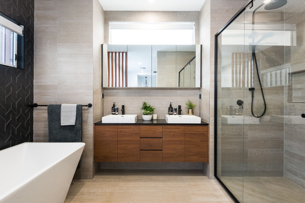 Inspiration for a contemporary bathroom in Brisbane with flat-panel cabinets, medium wood cabinets, an alcove shower, gray tile, a vessel sink, grey floor, black benchtops, a double vanity and a floating vanity.