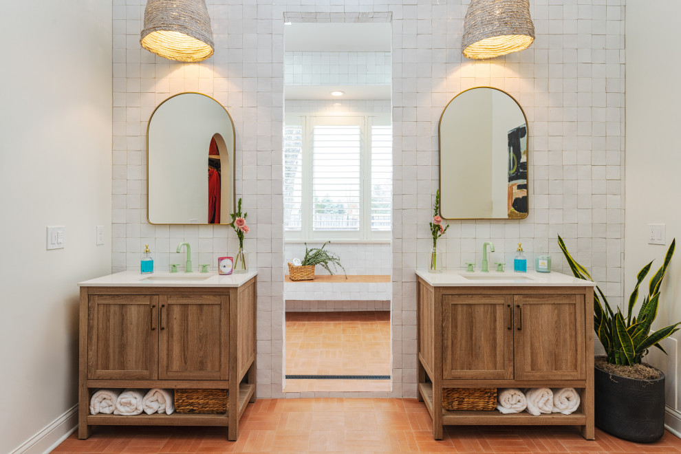 Open shower - mid-sized transitional master white tile and terra-cotta tile terrazzo floor, brown floor, double-sink and vaulted ceiling open shower idea in Kansas City with recessed-panel cabinets, brown cabinets, a two-piece toilet, white walls, a drop-in sink, quartz countertops, white countertops and a freestanding vanity