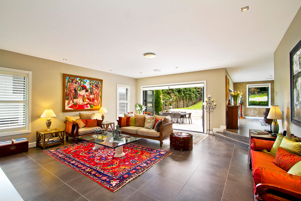This is an example of a large eclectic living room in Sydney with beige walls and no tv.