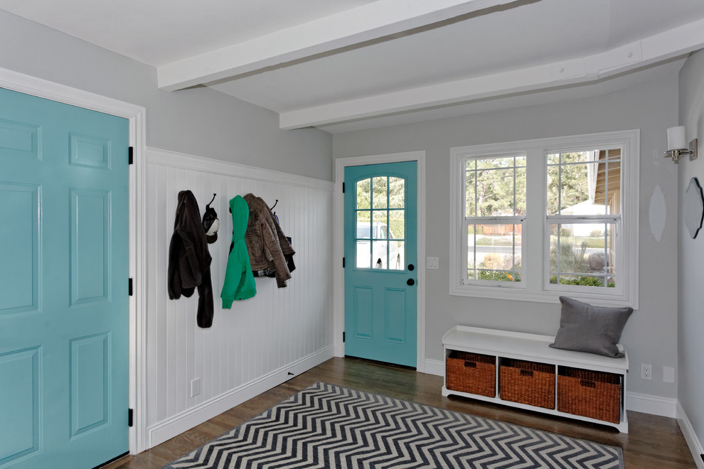 Inspiration for a large contemporary mudroom in San Francisco with dark hardwood floors and a single front door.