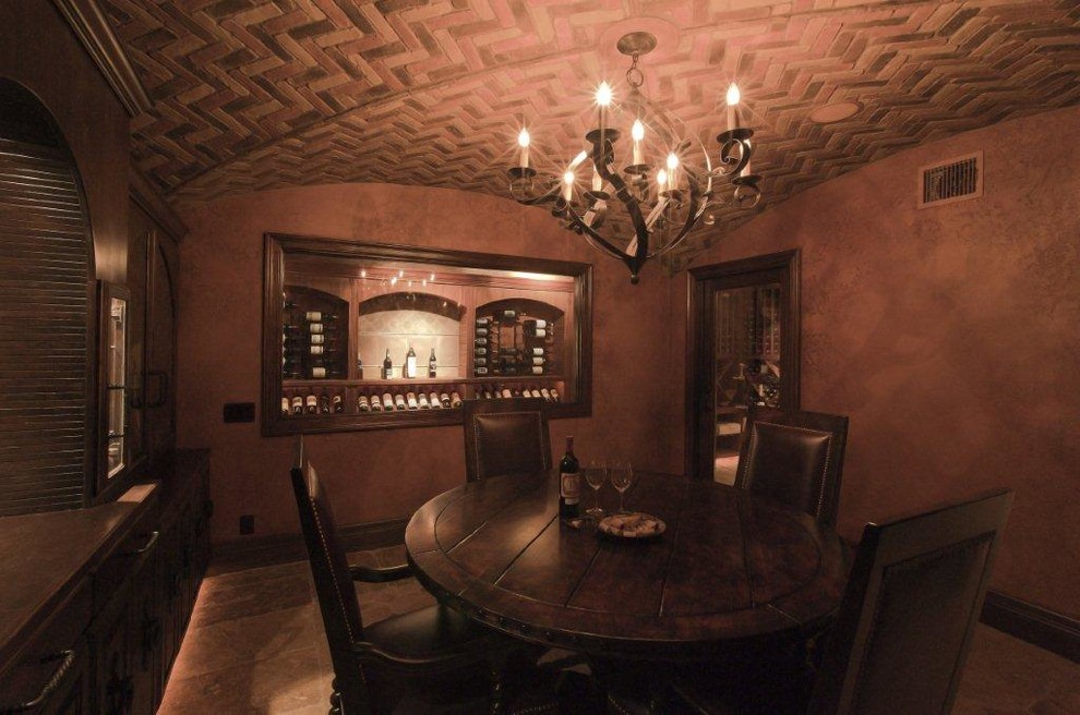 Wine cellar - huge rustic dark wood floor and brown floor wine cellar idea in Austin