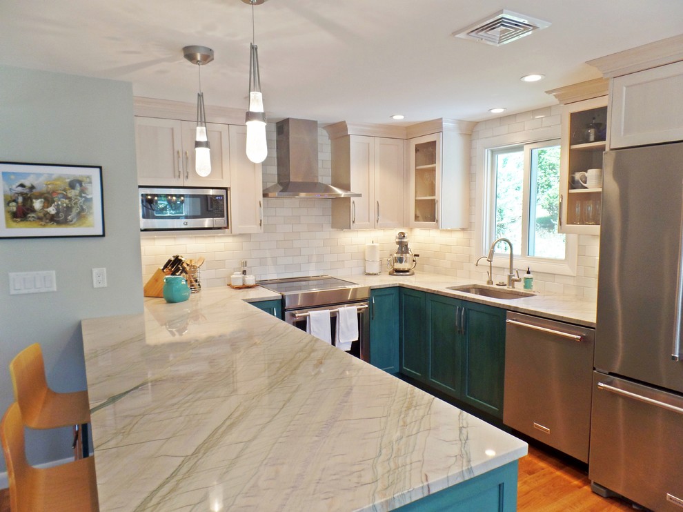 This is an example of a mid-sized transitional u-shaped eat-in kitchen in Other with an undermount sink, shaker cabinets, turquoise cabinets, quartzite benchtops, white splashback, ceramic splashback, stainless steel appliances, light hardwood floors, with island, white benchtop and beige floor.