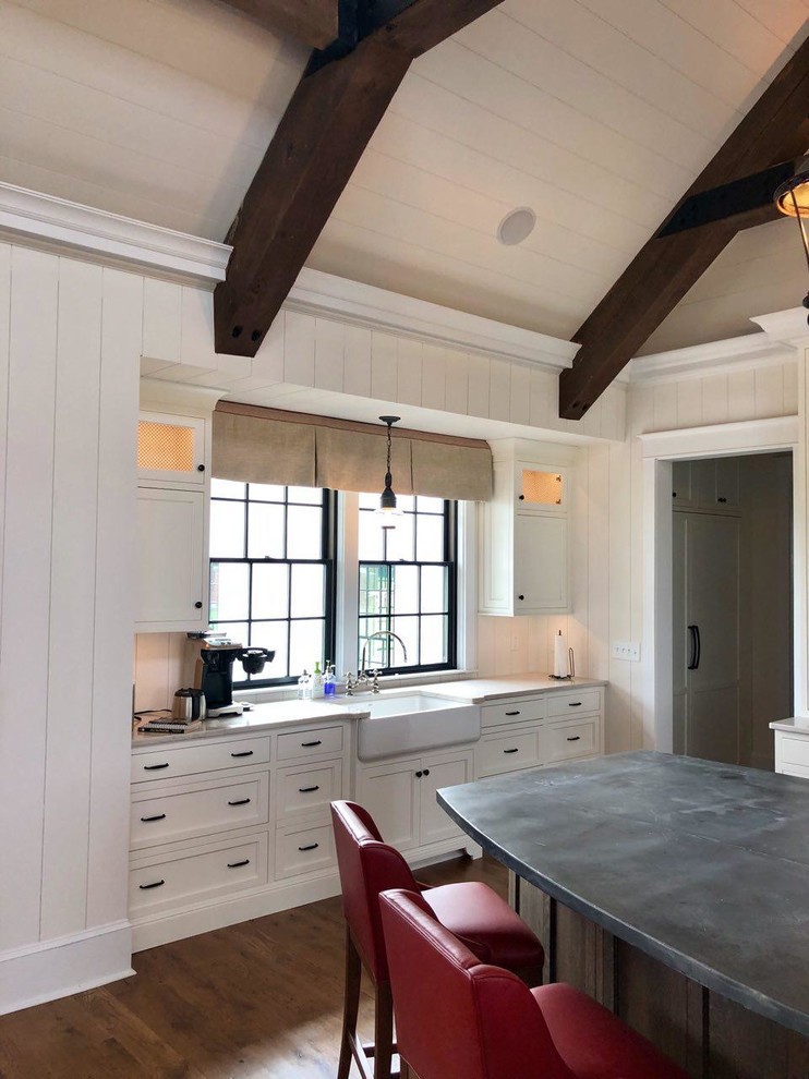 Inspiration for a large traditional eat-in kitchen in Other with a farmhouse sink, flat-panel cabinets, white cabinets, zinc benchtops, white splashback, panelled appliances, medium hardwood floors, with island, brown floor and multi-coloured benchtop.