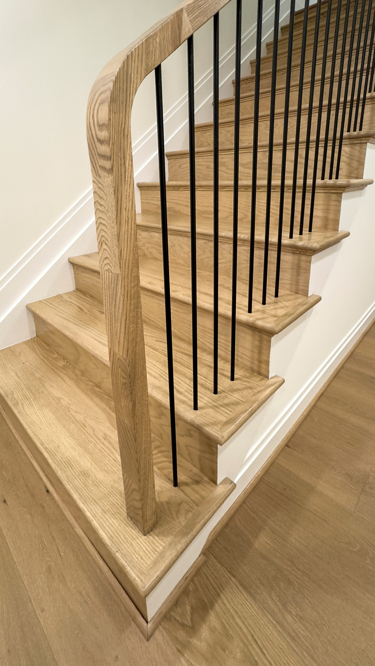 Stair Railing Transitional Example of a small transitional wooden curved mixed material railing ...