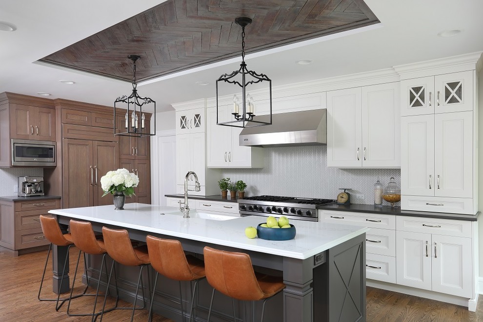 Design ideas for an eclectic kitchen in Chicago with stainless steel appliances, medium hardwood floors and with island.