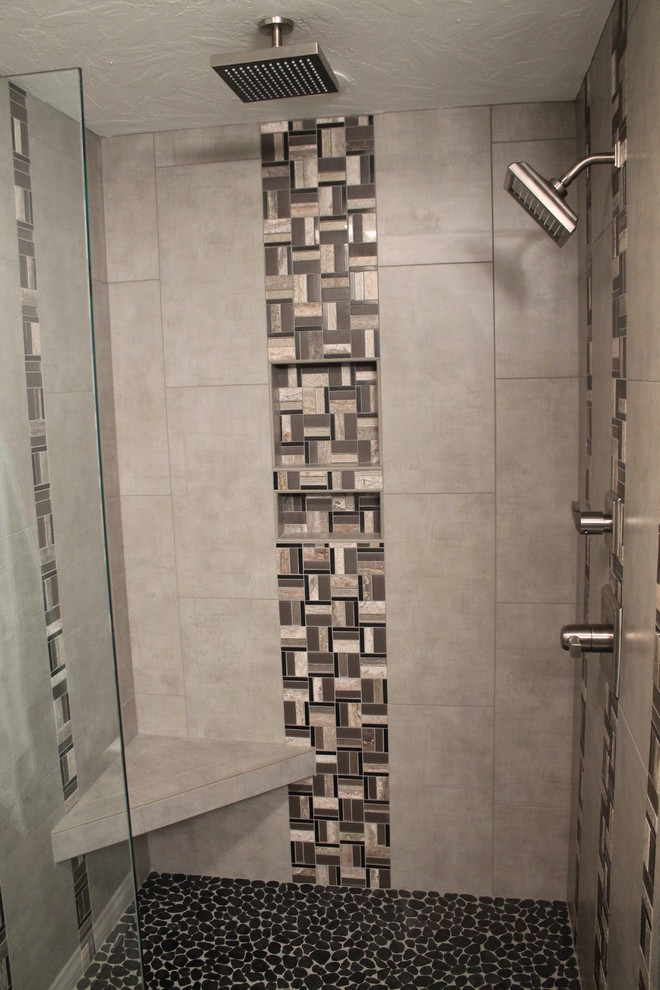 Photo of a contemporary master bathroom in Other with an open shower, multi-coloured tile, mosaic tile and pebble tile floors.