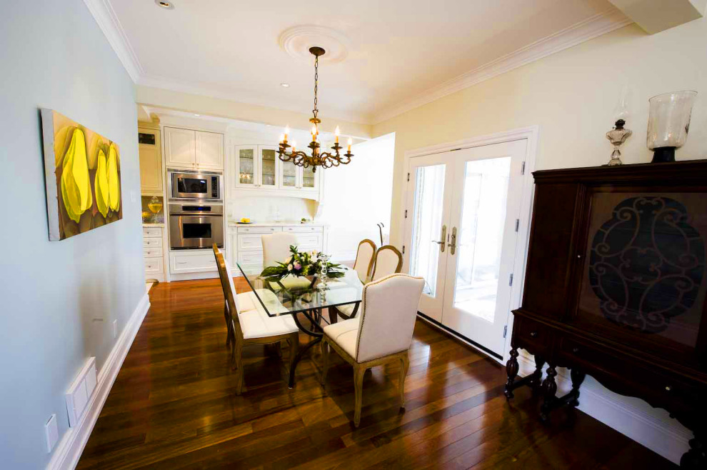 Photo of a medium sized classic dining room in Toronto with blue walls, dark hardwood flooring and brown floors.