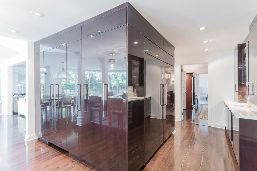 Eat-in kitchen - large transitional galley dark wood floor eat-in kitchen idea in Philadelphia with an undermount sink, recessed-panel cabinets, white cabinets, white backsplash, an island, quartzite countertops, ceramic backsplash and paneled appliances