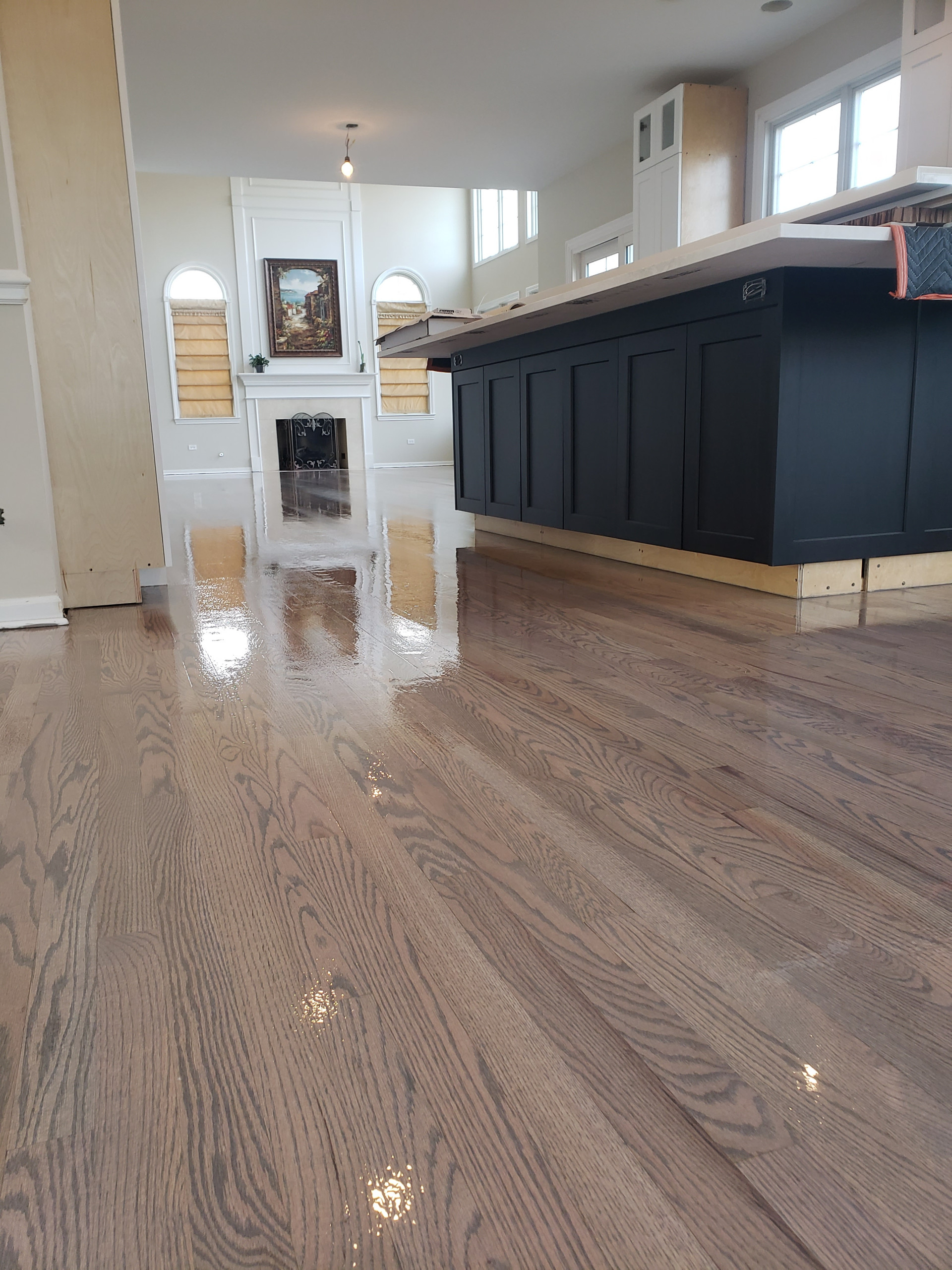 New 2 and 1/4 red oak flooring installed and old flooring refinished